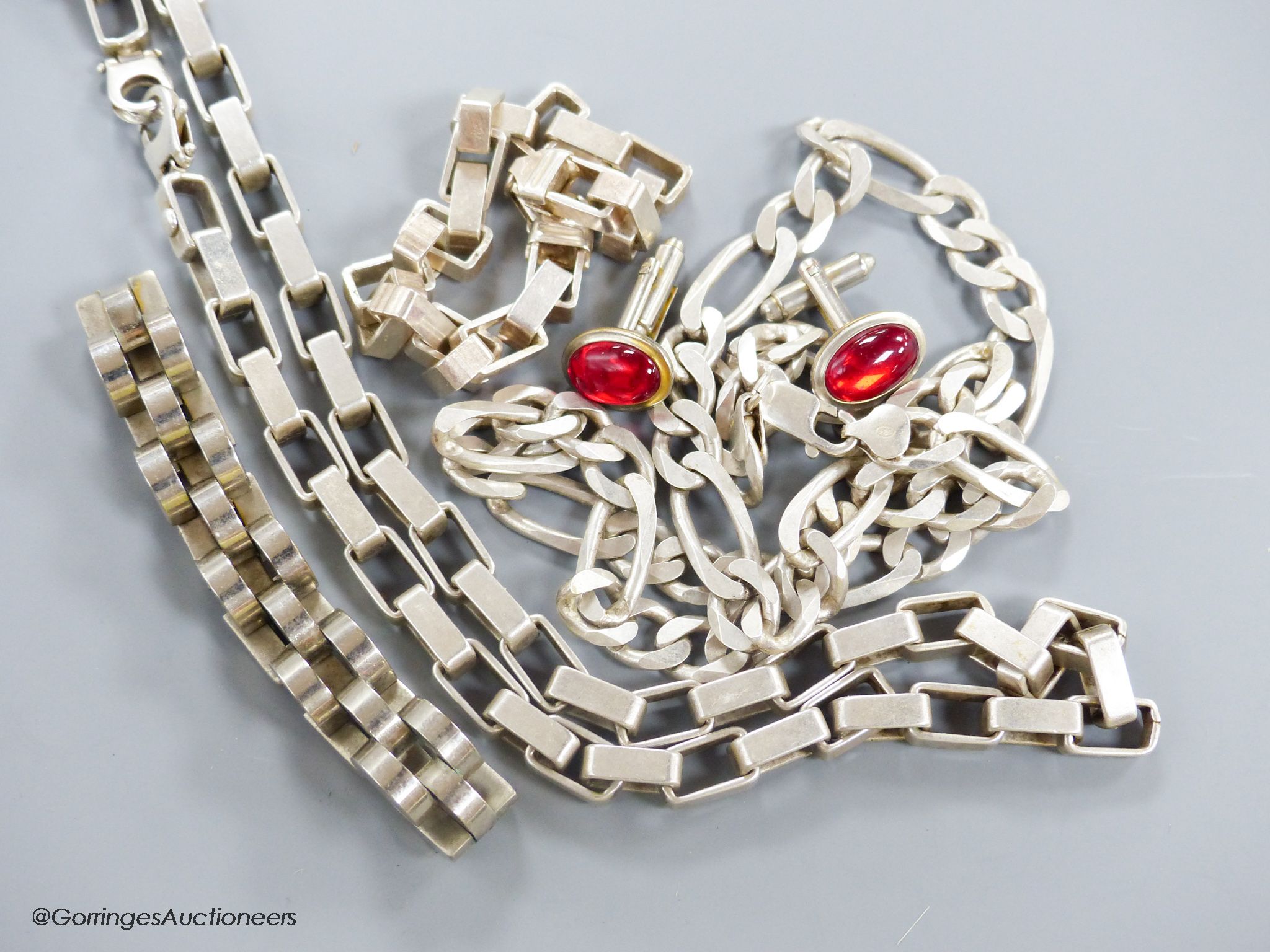 A silver (925) heavy rectangular link chain and matching bracelet, a similar fancy curb-link chain, a white metal semi-circle link bracelet and a pair of cufflinks
